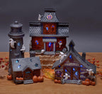Mark Feldstein & Associates Spooky Halloween Color Changing Pre-Lit LED Haunted House Village Set, 8 Inch, Set of 3